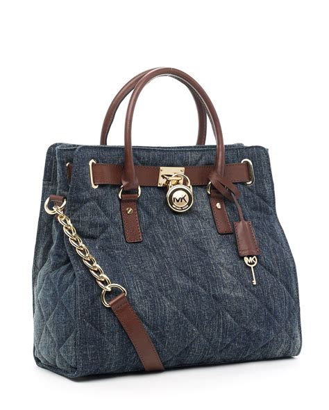 are michael kors denim purses treated to protect the fabric|Michael Kors denim tote.